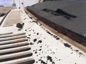 Rust on the cowl of a windshield 
